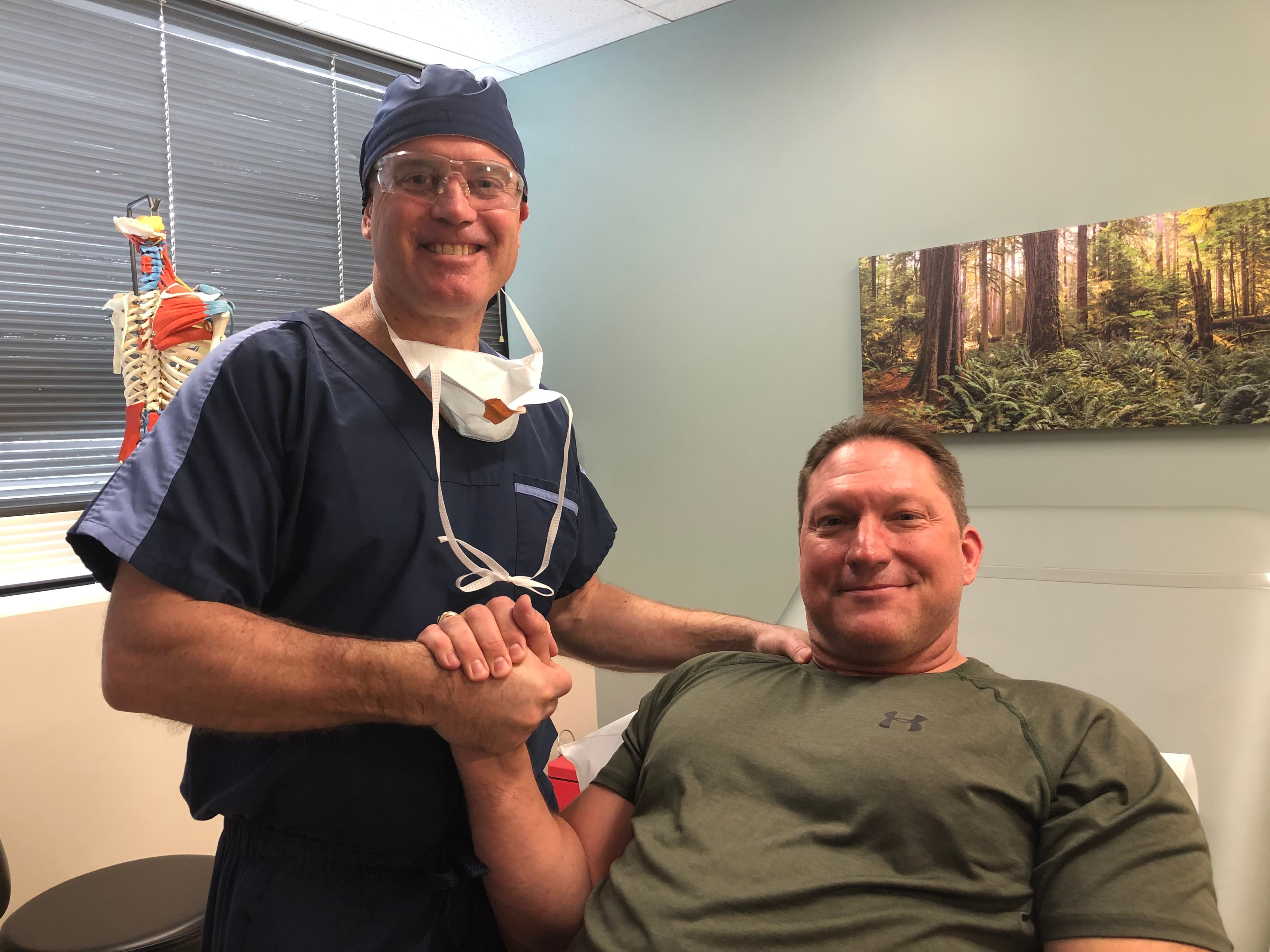 Dr. Mulvaney with a patient after a procedure