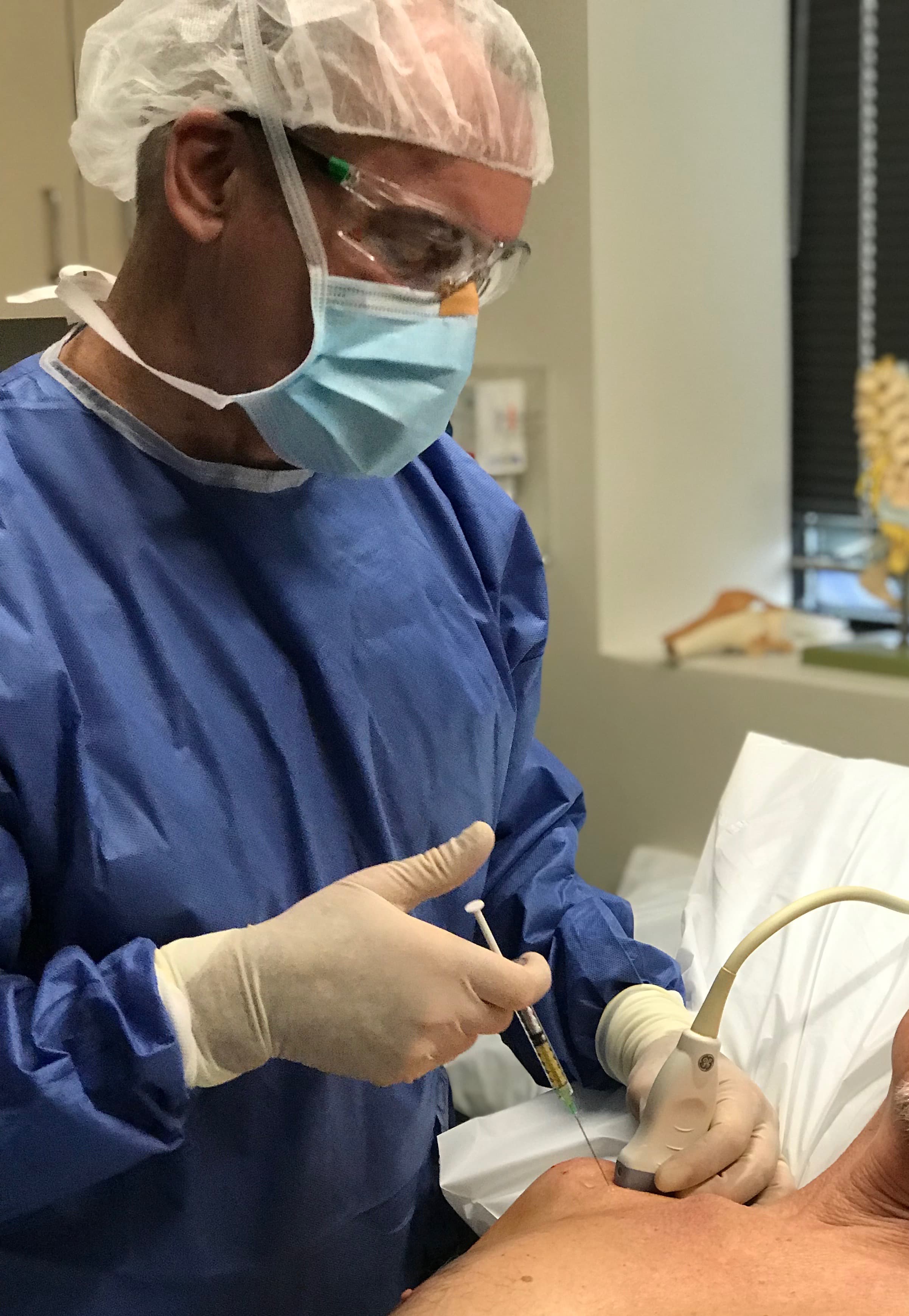 Dr. Mulvaney performing an ultrasound-guided micro-fragmented adipose injection