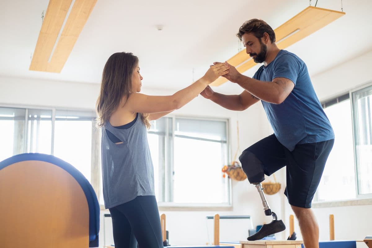 A patient doing balance exercises with a physical therapist during rehabilitation